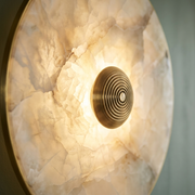 Close-up of alabaster veining and brass centre knob on a Kingston wall light