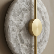 Close-up of alabaster veining and gold centre rod on a Chiswick wall light