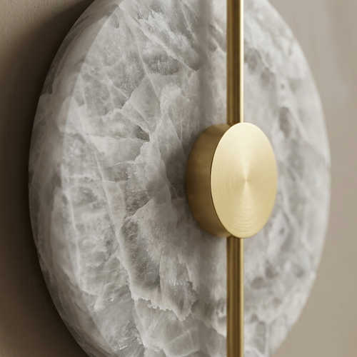 Close-up of alabaster veining and gold centre rod on a Chiswick wall light