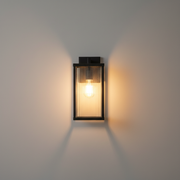 Mayfield Waterproof IP55 Solar Outdoor Light - black reeded-glass box lantern on a clean studio wall
