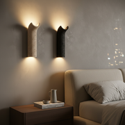 Dorset Travertine Wall Light - beige and black finishes, in a bedroom