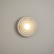 Avon Resin Round Wall Light - cream, on a clean studio wall