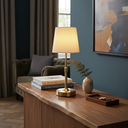 Cavendish Cordless Table Lamp - Gold, on a console table