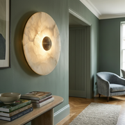 Kingston Alabaster Wall Light with brass centre knob, in a hallway
