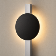 Close-up of the Kenwood matte-black light disc and brushed-silver vertical stem