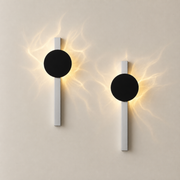 Pair of Kenwood battery wall lights with black discs and brushed-silver vertical stems