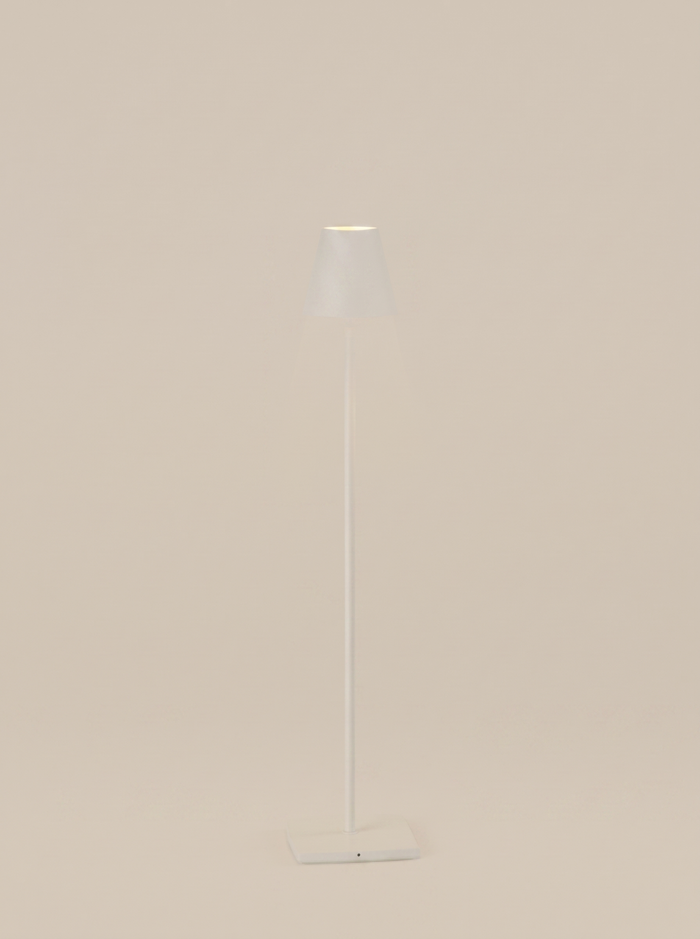 White cordless table lamp on a clean studio background