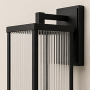 Close-up of the Mayfield matte-black frame, ribbed borosilicate glass and wall mount