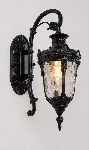 Notting Large glass lantern outdoor wall light in black with hammered glass, lit