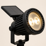 Close-up of the Oxford solar spotlight's two LED lenses, finned head, pivot bracket and panel