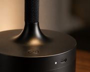 Close-up of the black Pembroke lamp knurled stem and USB-C rechargeable base