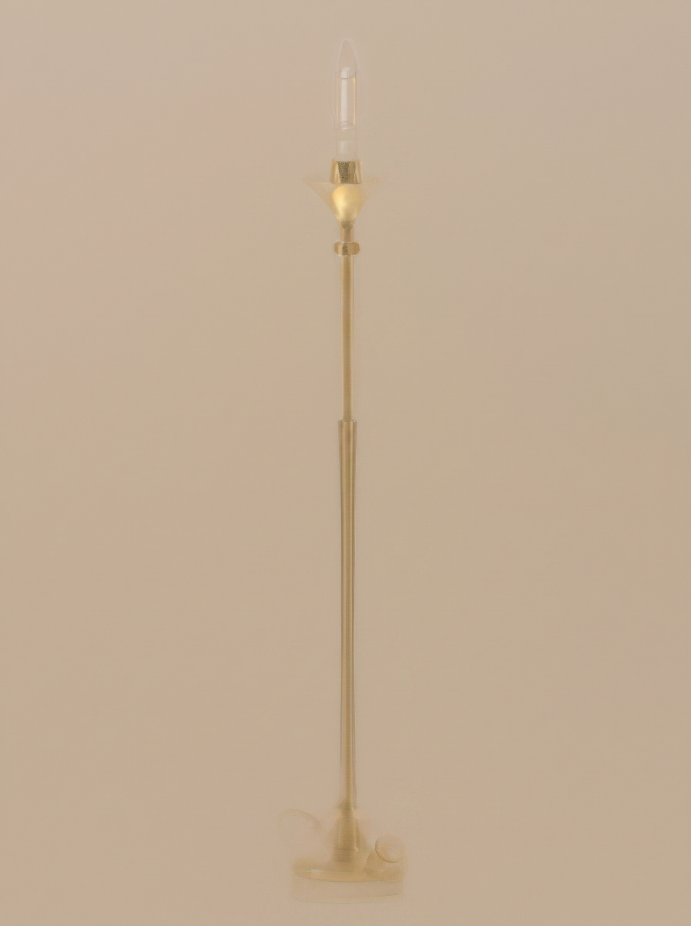 Gold cordless table lamp on a clean studio background
