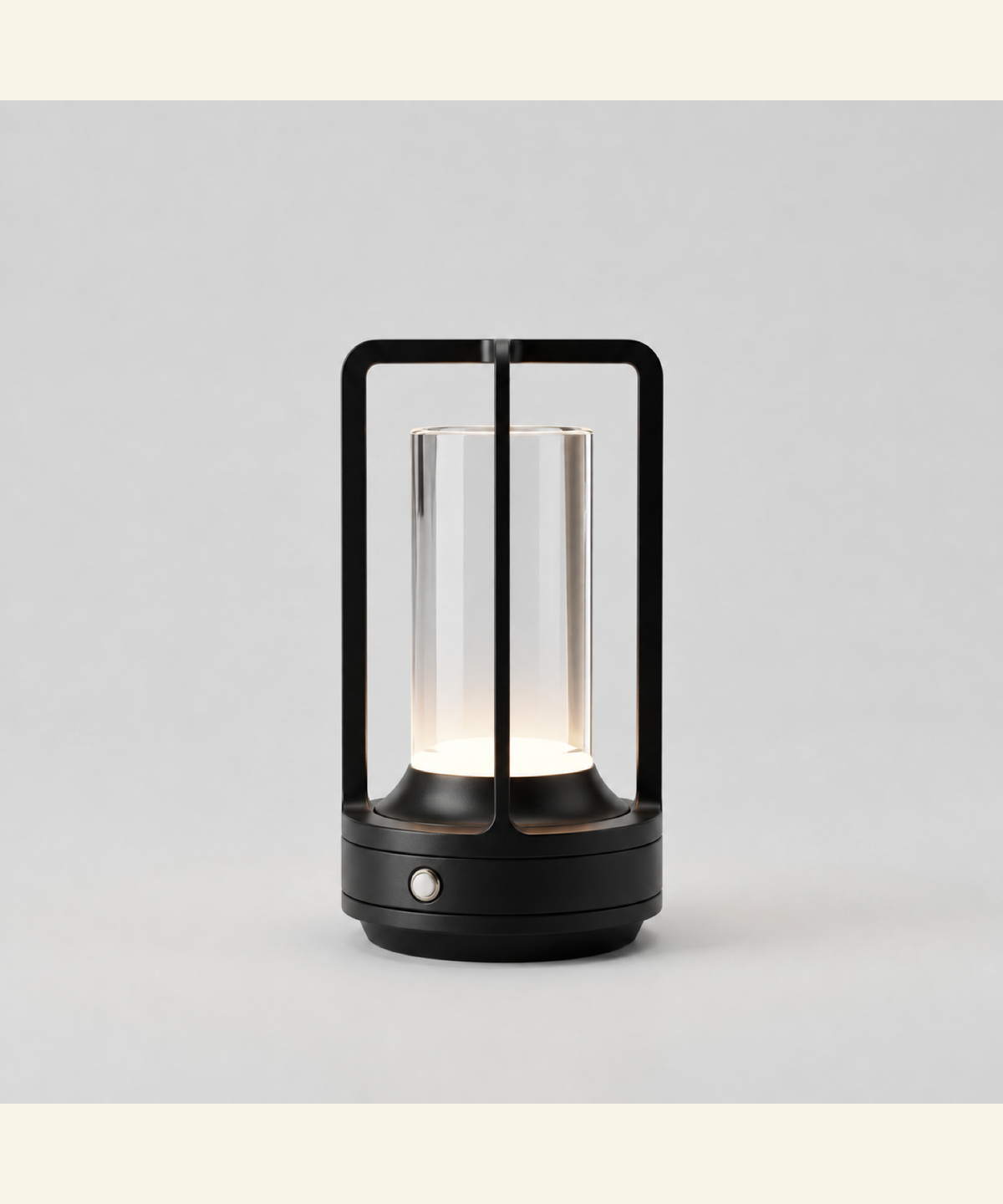 Black cordless table lamp switched on with a soft warm glow