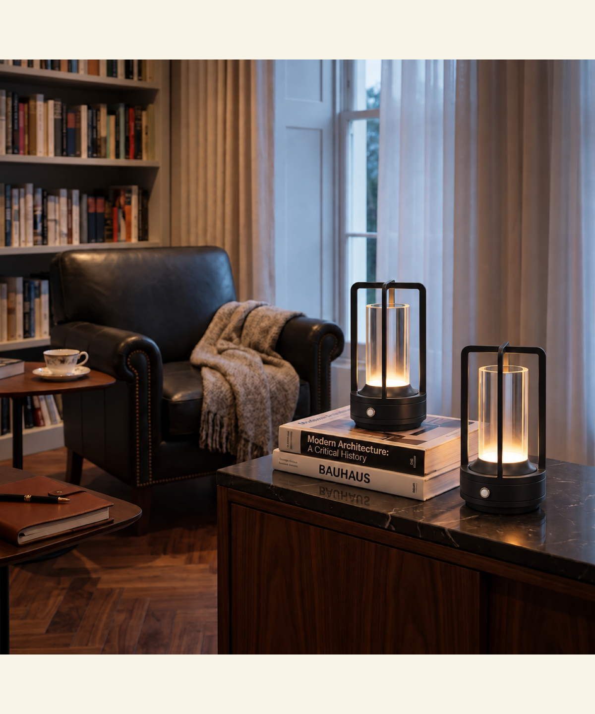 Pair of black Selby cordless table lamps on a marble-topped cabinet in a reading room